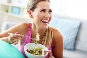 Women eating food with smile