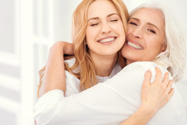 two women blonde hug