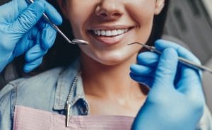 A Women a t dental clinic checking her teeths