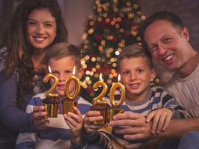 a family of four celebrating new year 2020