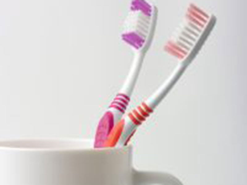 2 toothbrush in a cup