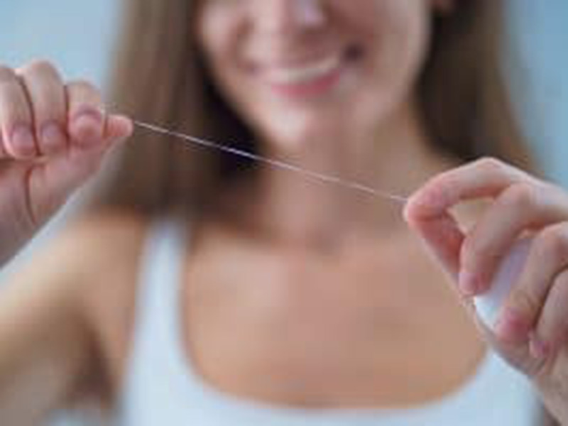 a woman showing a thread