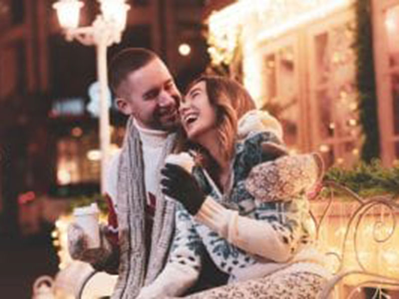 a couple drinking coffee and smiling