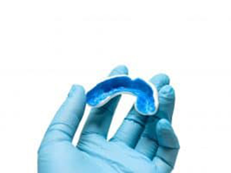 mouthguard in doctor's hand