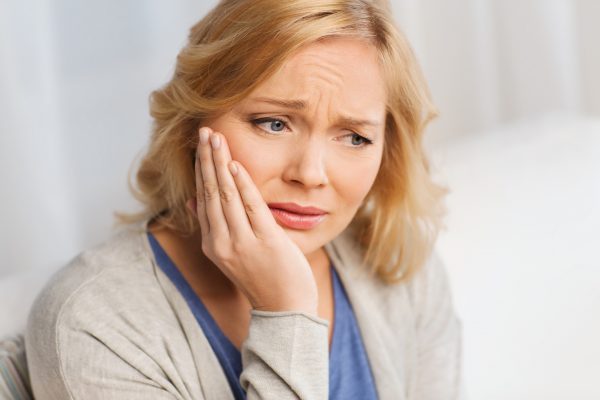 women suffering with toothache